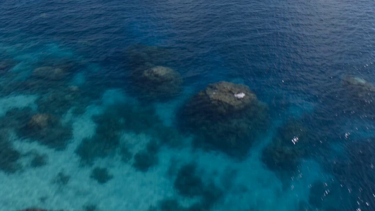 A hyper-realistic, high-cinematic aerial drone shot of a vintage yellow