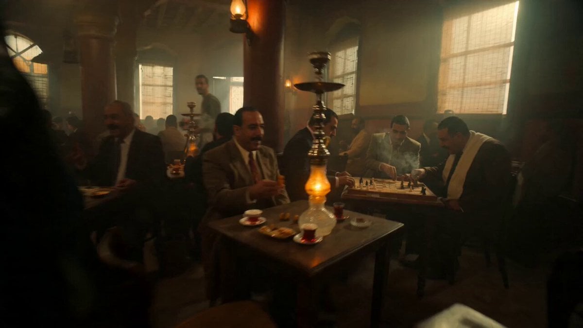 Fast handheld shot weaving through a crowded popular cafe in Downtown Cairo