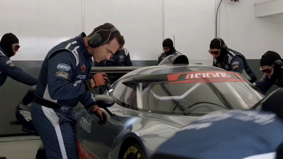 EVENT: Professional racing team's pit stop preparation moments before lights